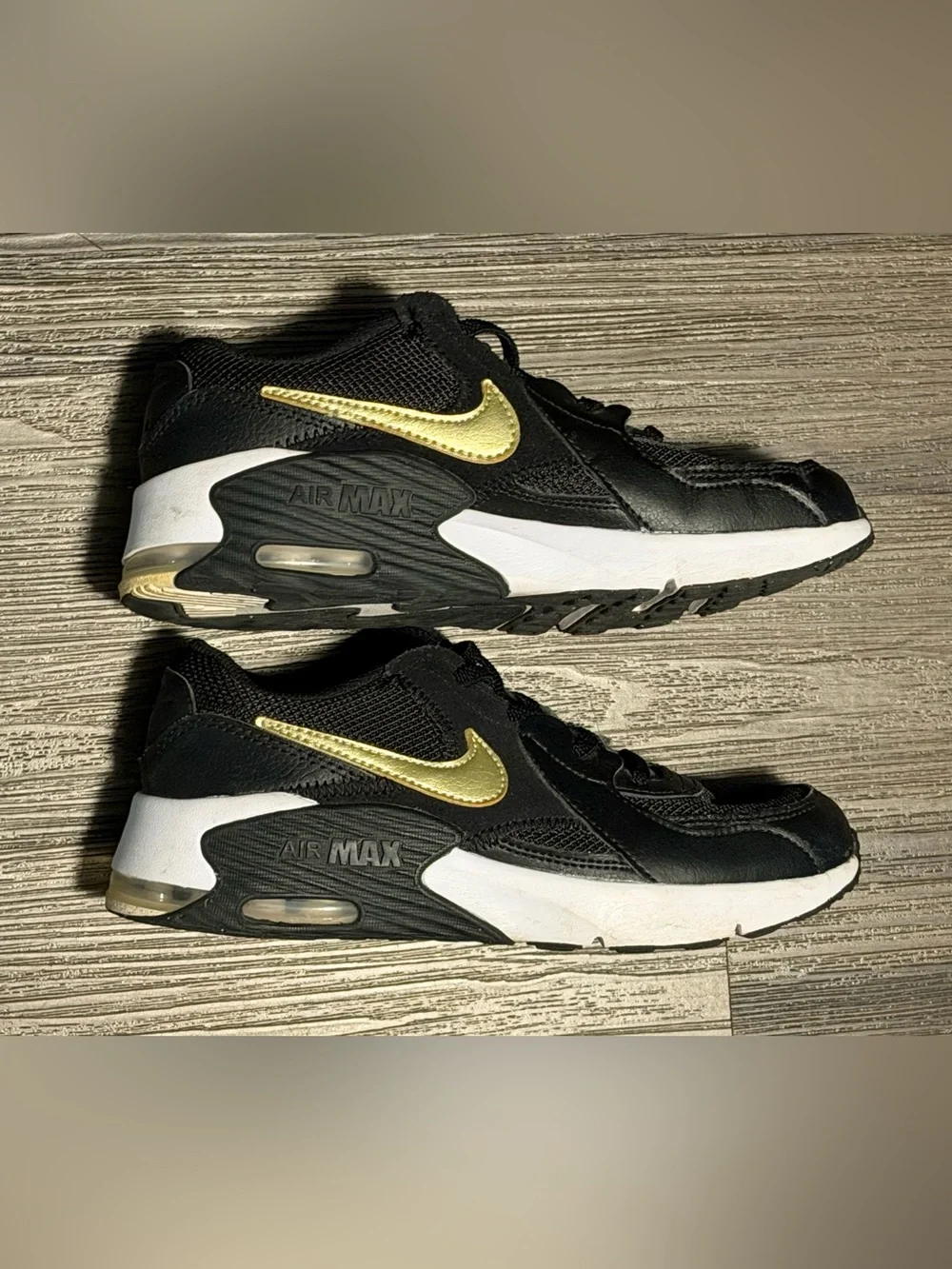 Nike Kids Black Sneakers with Gold Swoosh